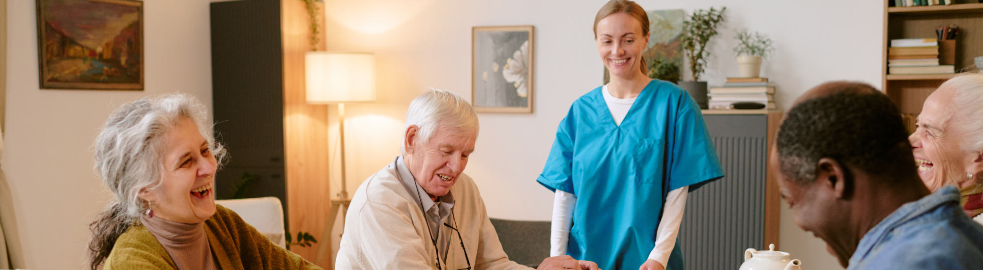 A group of elderly people talking with a nurse. 